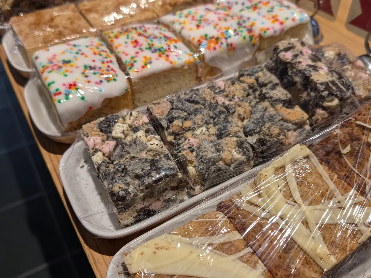 Trays of homemade traybakes on the café counter